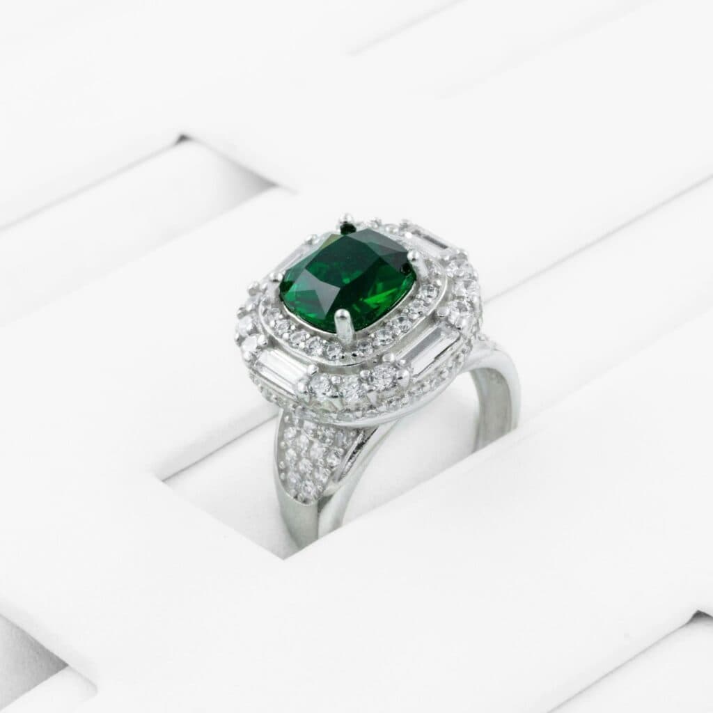 A vibrant green emerald ring