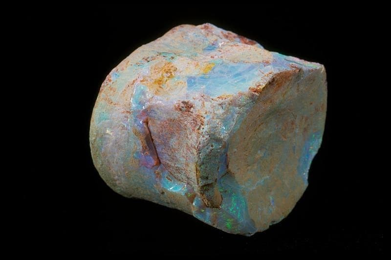 raw white opal with blue and green play of color